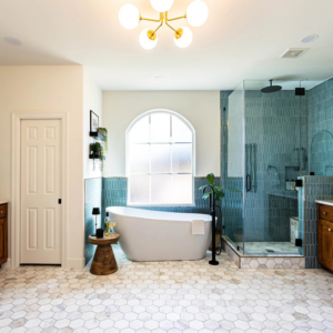 A complete bathroom remodel featuring a freestanding tub, glass shower, and custom vanity by Rockin' Remodeling LLC in Austin, TX