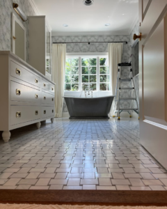 A full bathroom renovation featuring a freestanding tub and tiled floor by Kevin Cradock Builders in Boston, MA.