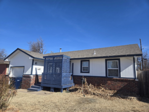 Full exterior house renovation, including siding and deck, by Complete Renovations in Bethany, OK