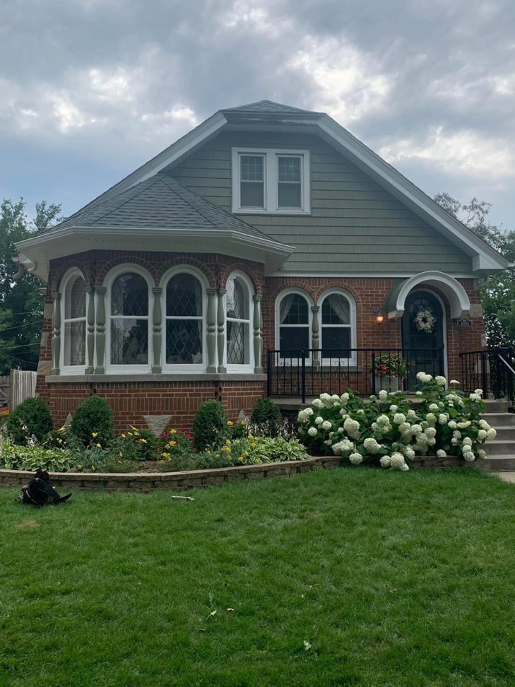 Full front view of a house with completed siding renovation by Sockett Siding, LLC in Milwaukee, WI