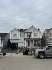 Full house roof replacement project with multiple workers by Darby Builders in Columbus, OH.