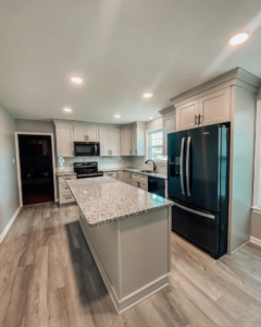A complete kitchen remodel with new cabinets, granite countertops, appliances, and flooring by Prestige Remodeling Solutions in Antioch, TN