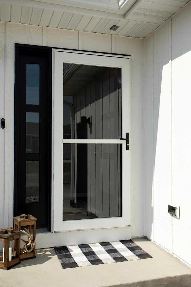 A sleek full-view white storm door installed on a modern home by Denver Storm Door in Denver, CO.