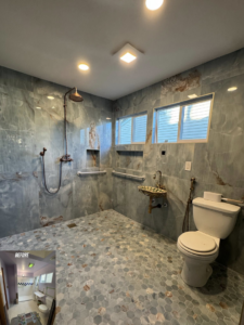 A fully renovated, accessible bathroom with a walk-in shower and grab bars by Adaptable Abodes, LLC in Portland, OR.