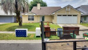 Old furniture and cabinets placed curbside for pickup by Westish Junk Removal LLC in Orlando, FL.
