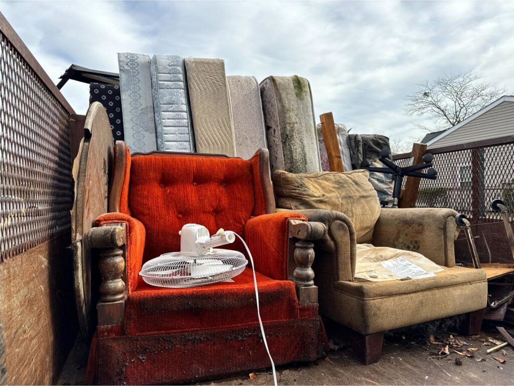 A truck loaded with old furniture and mattresses for junk removal by Insta Junk Removal & Demolition LLC in Salisbury, MD