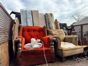 A truck loaded with old furniture and mattresses for junk removal by Insta Junk Removal & Demolition LLC in Salisbury, MD