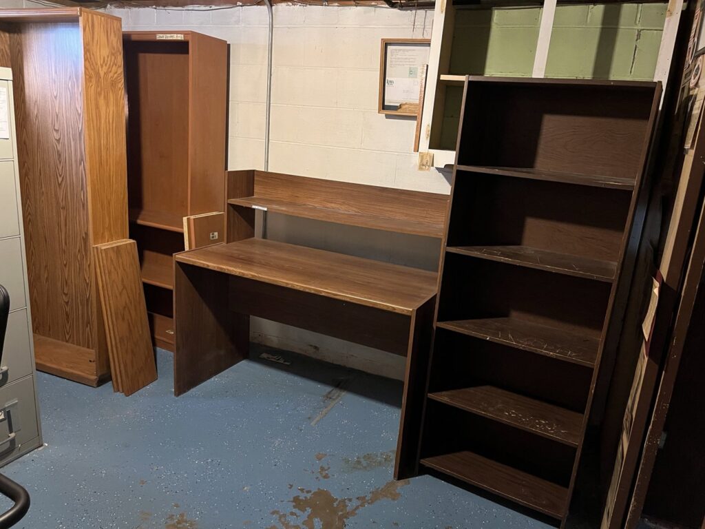 A room with wooden furniture ready for removal by The Goat Junk Removal in Ankeny, IA