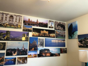 A beautifully arranged gallery wall with multiple framed art pieces, expertly installed by Rick's Handyman in Cheyenne, WY.