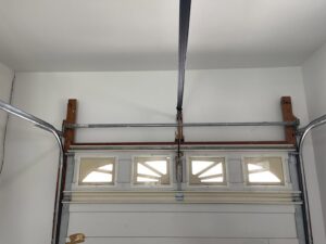 A garage ceiling with a fresh coat of paint, completed by Castle Drywall & Plaster in Chesapeake, VA.