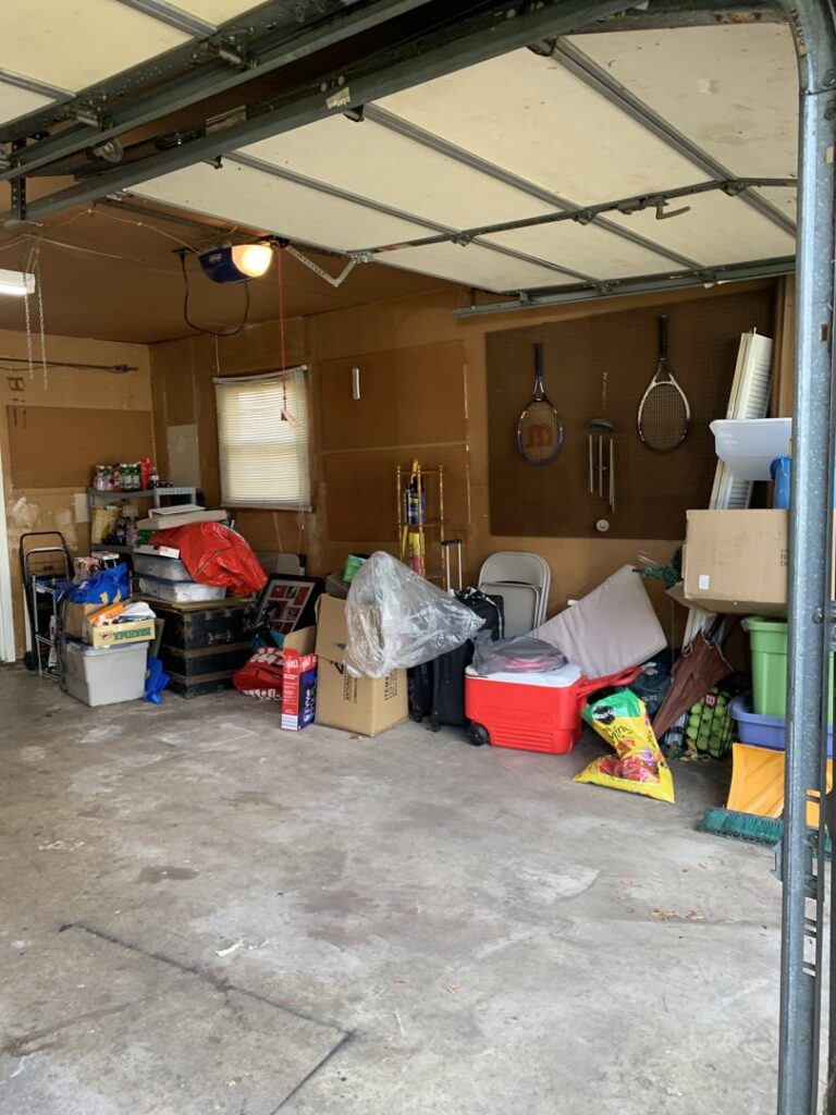 A garage filled with household clutter and junk, awaiting removal by Got Rubbish in Jersey City, NJ