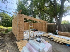 A garage under construction with wood framing and sheathing, a renovation project by Handy Fix Co. in Cleveland, OH.