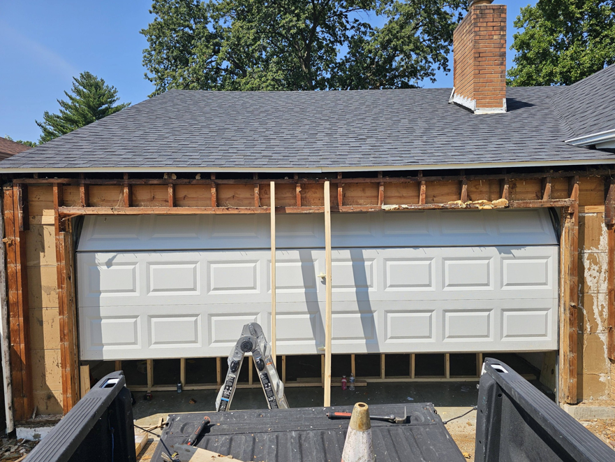 Garage door opening framing repair in progress by AIS Home Service's in St. Louis, MO.