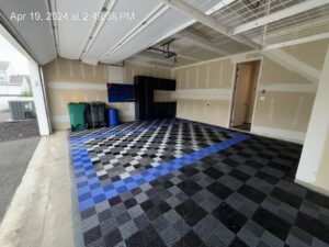 A newly installed checkered floor in a garage renovation by Ridgely Home Services LLC in Pittsburgh, PA.