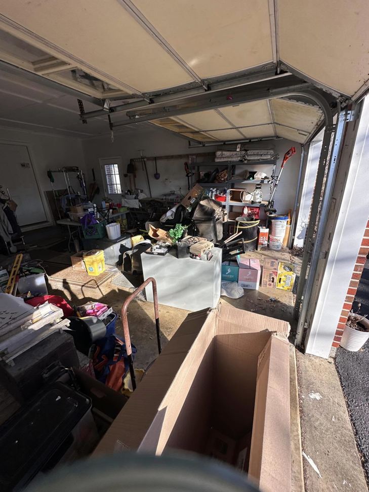 A garage overflowing with junk and boxes, ready for cleanup by 302-Rid-Junk in Wilmington, DE.