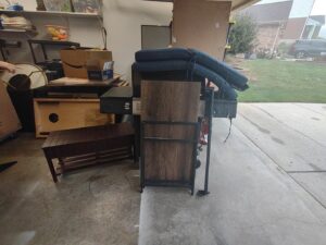 A garage filled with various items and furniture, indicating a junk removal service from 1-800-Declutter in Cincinnati, OH.
