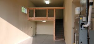 A newly constructed garage loft with stairs and an installed HVAC unit by Constructed by 360 LLC in Meridian, ID.