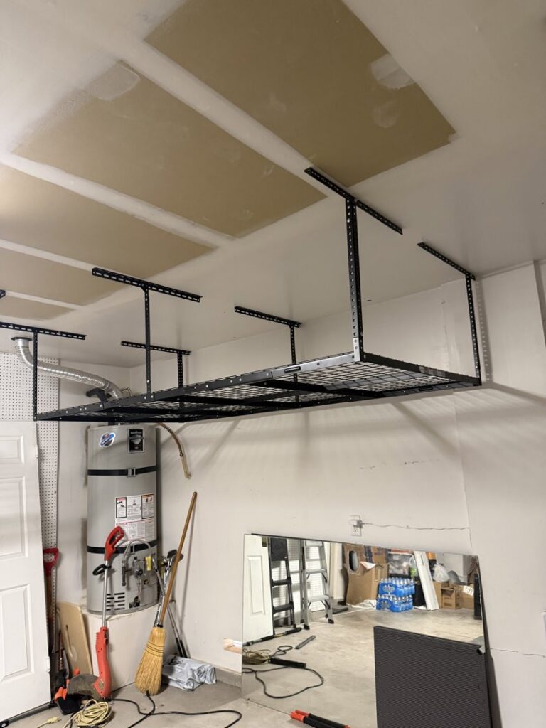 A newly installed overhead storage rack system in a garage, completed by Tech Handy-Las Vegas in North Las Vegas, NV.