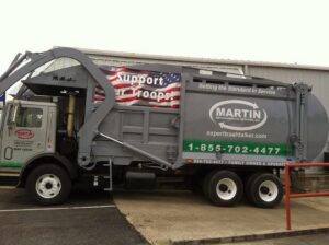 A Martin Environmental garbage truck parked, ready for waste collection in Dothan, AL.