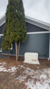 A Generac home standby generator professionally installed next to a house by L12 Construction LLC in Oshkosh, WI.