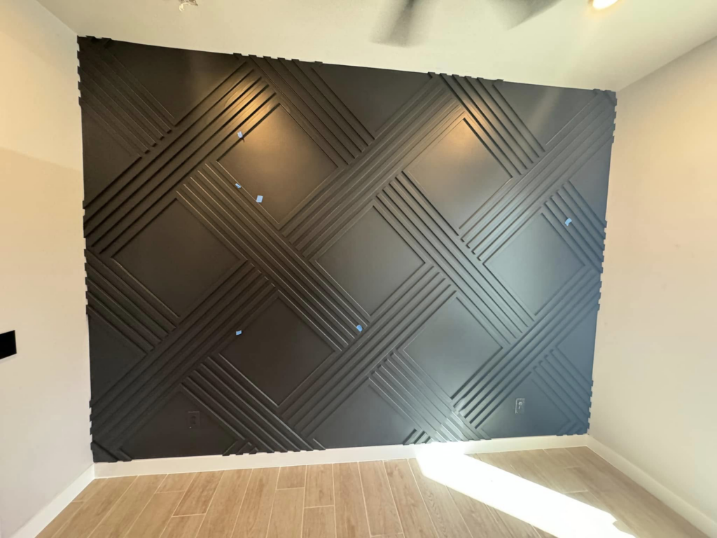 A modern geometric black accent wall, completed by D.R. Construction in El Paso, TX.