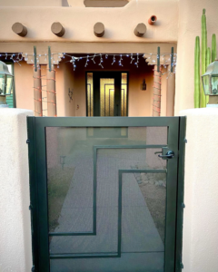 A custom geometric wrought iron entry gate installed by Chavez Wrought Iron, LLC in Tucson, AZ