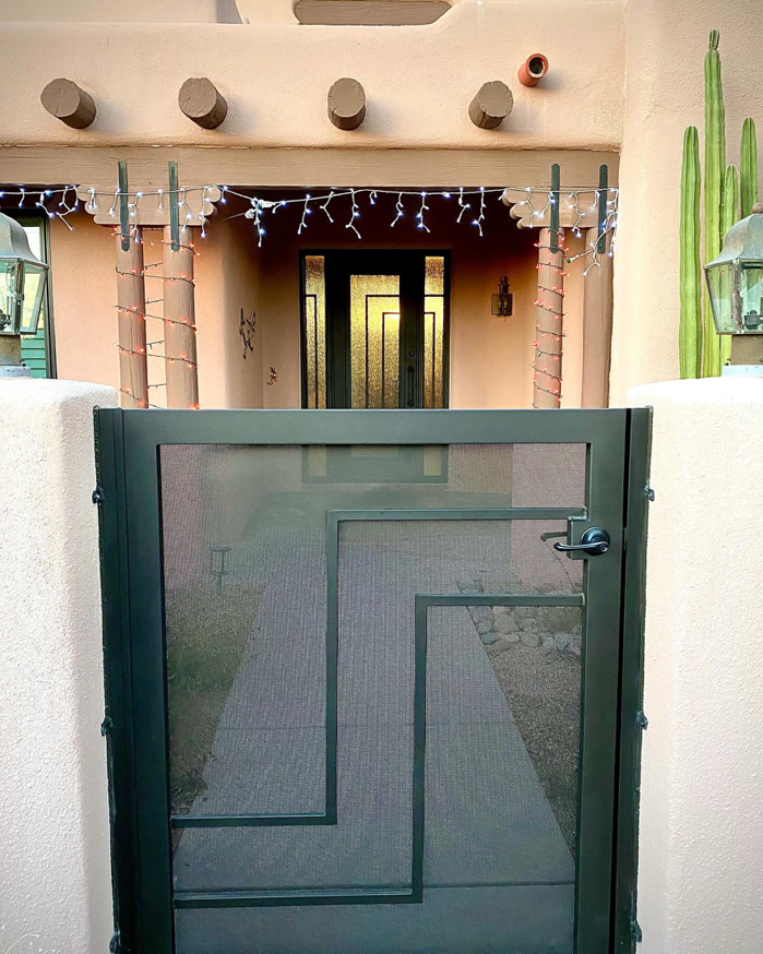 A custom geometric wrought iron entry gate installed by Chavez Wrought Iron, LLC in Tucson, AZ