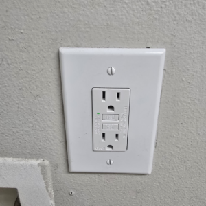 A newly installed GFCI electrical outlet on a wall by Gragg Electrical Services, LLC in East Canton, OH.
