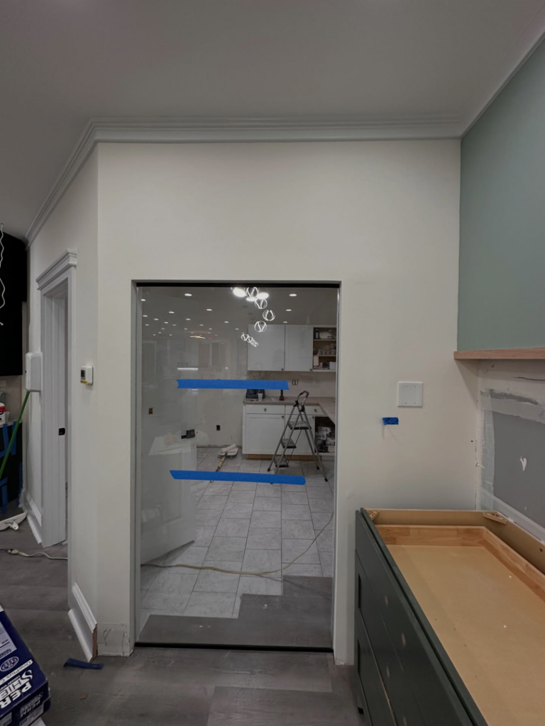 Professional glass door installation in a kitchen undergoing renovation by MW Glass in Stamford, CT.
