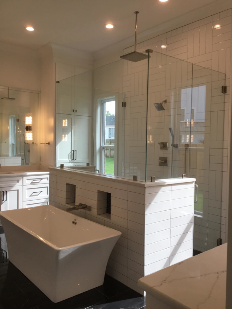 Expert glass shower enclosure and tile installation by Berry Builders, L.L.C. in Shreveport, LA.