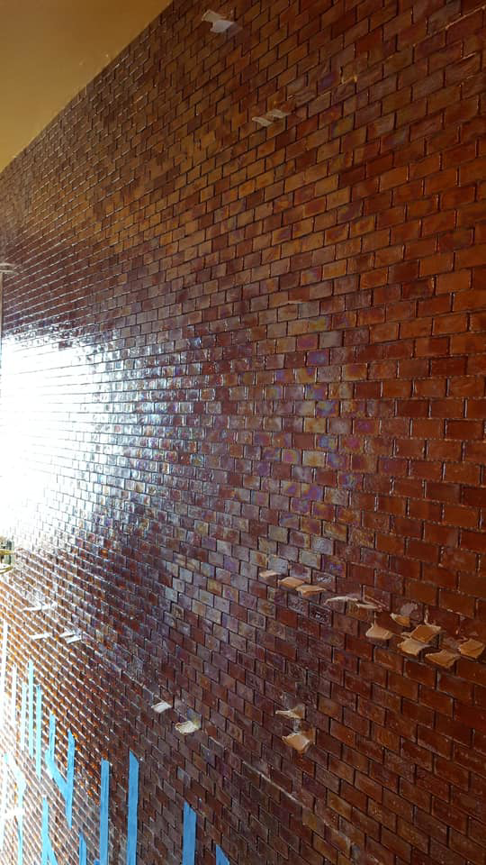 A glossy tiled accent wall installation by Peterson Home Improvement LLC in Highland, NY.