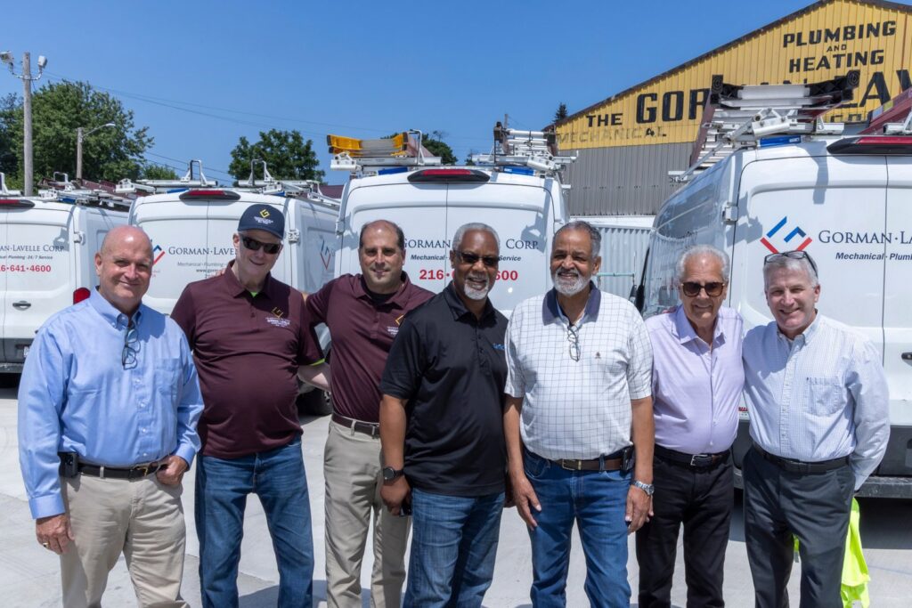 Gorman-Lavelle Corp employees gathered in front of their service vans and facility in Cleveland, OH