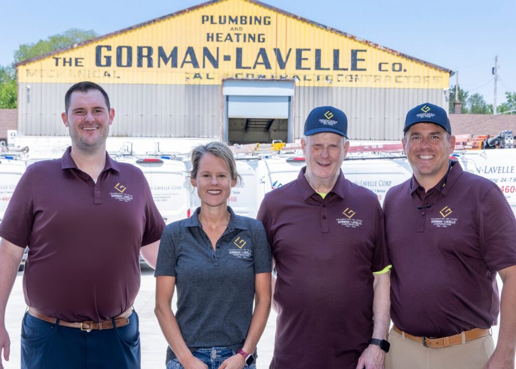 The Gorman-Lavelle Corp team standing in front of their building and service vans in Cleveland, OH