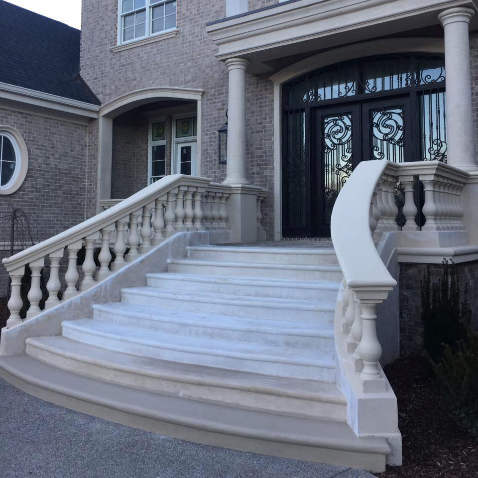 Grand exterior staircase and entrance with stucco and masonry balustrades by Old Style European Stucco & Masonry in Brentwood, TN