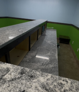 Expert granite countertop installation with custom shelving by Triple S Construction LLC in Hopkinsville, KY.