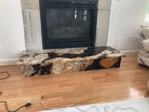 Granite fireplace hearth installation in progress by Diamond Stone Works in Virginia Beach, VA