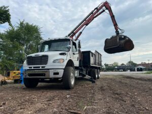 A grapple truck, or log loader, used for moving heavy tree logs and debris by Raptors Tree Service LLC in Hammond, IN.