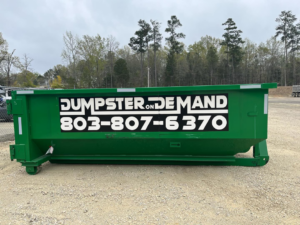A large green dumpster from Dumpster on Demand, ready for junk removal services in Columbia, SC.