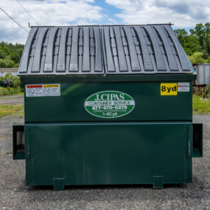 A green dumpster provided by J.Cipas Container Service for junk removal in South Plainfield, NJ.