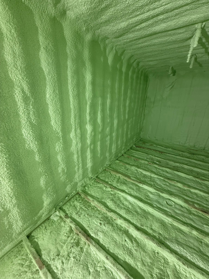 Green spray foam insulation applied to a crawl space or basement by Albany Spray Foam Solutions in Coxsackie, NY