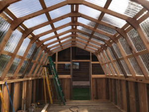 Greenhouse framing and roof panel installation by Handyman Robert in Columbia Falls, MT.