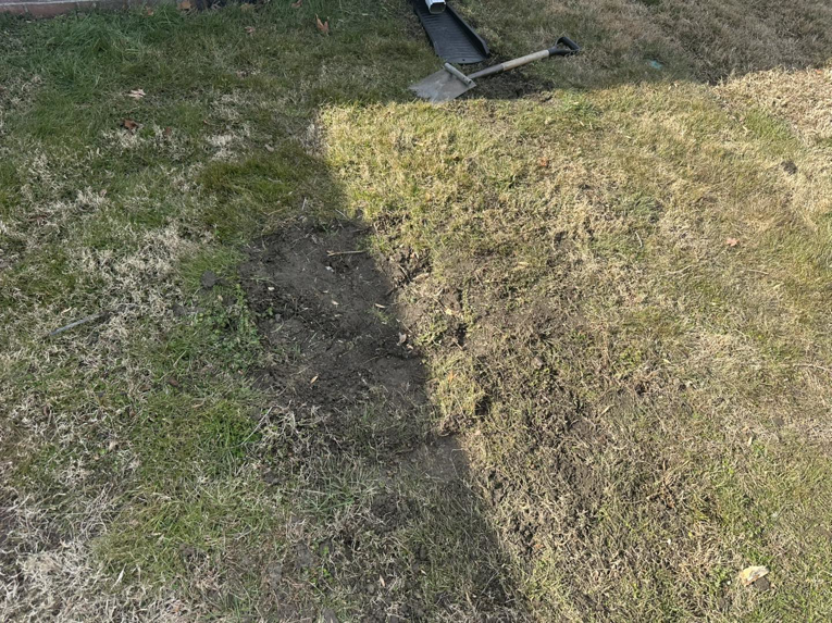 Ground prepared for a new drainage system installation by Jps handyman services,inc in Hampton, VA.