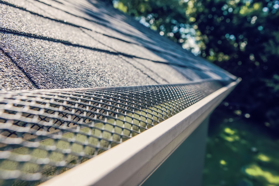 A close-up view of a newly installed gutter guard on a roof, a handyman service by ACE Roofing & Construction in Ruskin, FL