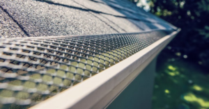 A close-up of a newly installed gutter guard on a roof by Blown Rite Insulation and Gutters in Wilmington, NC.
