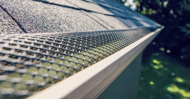 A close-up of a newly installed gutter guard on a roof by Blown Rite Insulation and Gutters in Wilmington, NC.