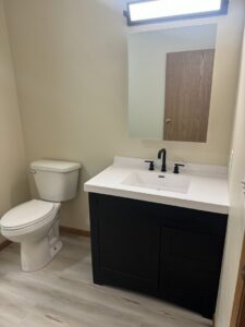 Half-bathroom renovation with new vanity, toilet, and flooring by Midwest Handyman LLC in West Fargo, ND.