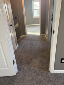 Completed carpet installation in a hallway and adjacent room by DC Home Solutions in Atlanta, GA.