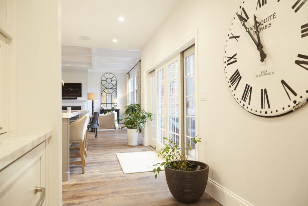 A bright hallway and entryway with a large wall clock, a project by Creasey Construction of Illinois, Inc. in Springfield, IL