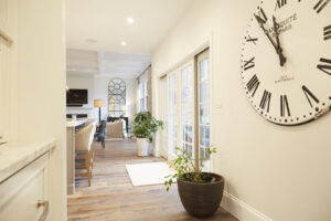 A bright hallway and entryway with a large wall clock, a project by Creasey Construction of Illinois, Inc. in Springfield, IL