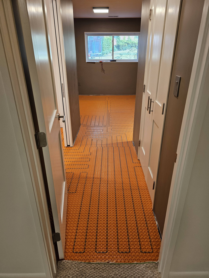 Hallway floor underlayment being prepared for new flooring by AIS Home Service's in St. Louis, MO.